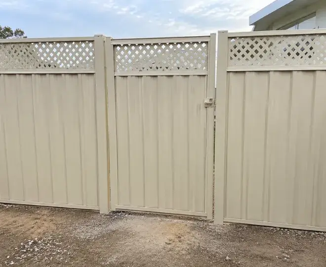 A beige fence featuring lattice decoration at the top in Centenary Heights