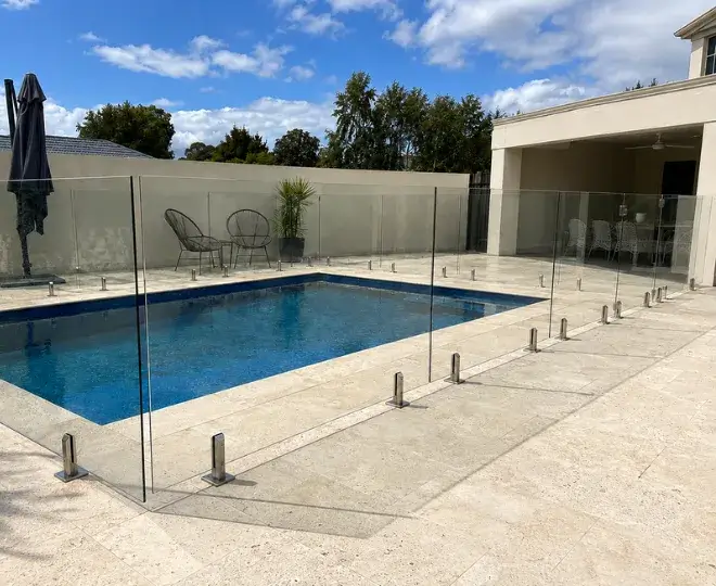 A clear glass pool fence surrounding a pool area in North Toowoomba