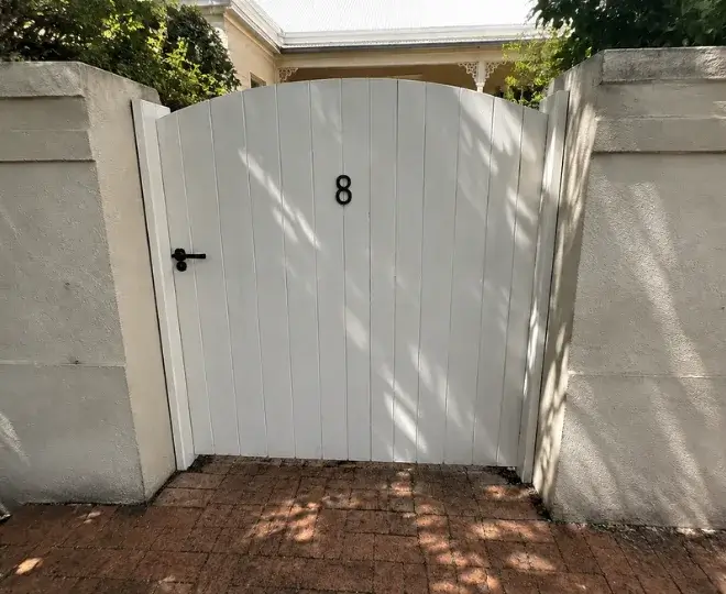 A white timber gate in Wilsonton